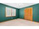 Empty bedroom with carpet, closet, and natural light from window at 2100 Fort Dr, Clayton, NC 27520
