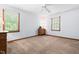 Bedroom featuring neutral walls, carpet and two windows at 2100 Fort Dr, Clayton, NC 27520