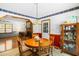 Dining room with hardwood table, chairs, and decorative light fixture at 2100 Fort Dr, Clayton, NC 27520