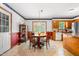 Cozy dining room featuring wood furniture and natural light through french doors at 2100 Fort Dr, Clayton, NC 27520