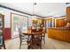 Bright dining area with table set and outdoor view through glass doors at 2100 Fort Dr, Clayton, NC 27520