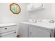 Bright laundry room with modern washer and dryer, plus storage cabinets at 2100 Fort Dr, Clayton, NC 27520