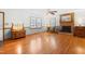 Spacious living room with hardwood floors, fireplace, ceiling fan, and ample natural light, creating a cozy atmosphere at 2100 Fort Dr, Clayton, NC 27520