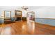 Bright living room featuring hardwood floors, a brick fireplace, and classic decor, perfect for gatherings and relaxation at 2100 Fort Dr, Clayton, NC 27520