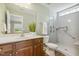 Accessible bathroom featuring a walk-in shower, grab bars, and a spacious vanity area at 217 Braxcarr St, Holly Springs, NC 27540