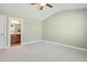 Well-lit bedroom with en suite bathroom access at 217 Braxcarr St, Holly Springs, NC 27540