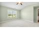 Inviting bedroom with vaulted ceiling, neutral walls, and a window offering a pleasant view at 217 Braxcarr St, Holly Springs, NC 27540