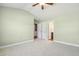 Spacious bedroom with neutral walls and carpet, featuring closet and bathroom access at 217 Braxcarr St, Holly Springs, NC 27540