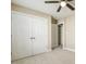 Bedroom featuring a ceiling fan and double door closet at 217 Braxcarr St, Holly Springs, NC 27540