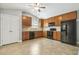 Well-equipped kitchen features ample cabinet space, appliances, and tile flooring at 217 Braxcarr St, Holly Springs, NC 27540
