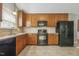 This kitchen features ample cabinet space, appliances, and tile backsplash at 217 Braxcarr St, Holly Springs, NC 27540