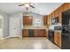 Well-equipped kitchen features ample cabinet space, appliances, and tile flooring at 217 Braxcarr St, Holly Springs, NC 27540