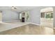 Bright living area with a fireplace, modern fixtures, and seamless flow into the kitchen area at 217 Braxcarr St, Holly Springs, NC 27540