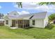 Charming rear exterior features a screened-in porch, perfect for outdoor living and entertaining at 217 Braxcarr St, Holly Springs, NC 27540