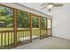 Charming screened-in porch perfect for enjoying the outdoors while being protected from the elements at 217 Braxcarr St, Holly Springs, NC 27540