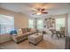 Cozy bonus room with a comfortable sofa, neutral tones, and natural light, ideal for relaxation at 221 Mayfield Dr, Apex, NC 27539