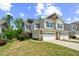 Charming townhome showcasing a well-kept lawn and neutral siding, perfect for low-maintenance living at 221 Mayfield Dr, Apex, NC 27539