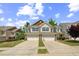 Beautiful townhome featuring an attached two-car garage and manicured lawn, offering modern convenience at 221 Mayfield Dr, Apex, NC 27539