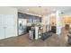 Well-equipped kitchen featuring dark cabinetry, stainless steel appliances, and a convenient breakfast bar at 221 Mayfield Dr, Apex, NC 27539