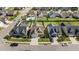 Aerial view of the neighborhood, highlighting the home's fenced yard, patio, and landscaping at 24 Sweet Birch Row, Youngsville, NC 27596