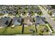 Aerial view of the home with a well-manicured lawn, fenced backyard, and patio at 24 Sweet Birch Row, Youngsville, NC 27596