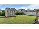Well-maintained backyard with a storage shed and lush green lawn at 24 Sweet Birch Row, Youngsville, NC 27596