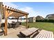 Spacious backyard featuring a pergola, patio furniture, and a shed at 24 Sweet Birch Row, Youngsville, NC 27596
