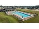 Community pool with sun loungers and a covered seating area in a Gathering-friendly neighborhood at 24 Sweet Birch Row, Youngsville, NC 27596