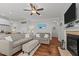 Cozy living room featuring hardwood floors, fireplace, and comfortable seating arrangement, perfect for relaxation at 24 Sweet Birch Row, Youngsville, NC 27596