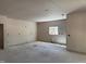 Bright living room featuring unfinished drywall, concrete floor, and a window for natural light at 240 Green Pines Estates Dr, Kenly, NC 27542