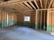 Interior view of an unfinished room, showing framing and concrete floor at 240 Green Pines Estates Dr, Kenly, NC 27542