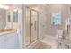 Bathroom features a walk-in shower, white vanity, and neutral paint, fixtures and decor at 313 Helmsdale Dr, Chapel Hill, NC 27517