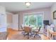 Eat-in kitchen nook features a circular table with views of the backyard through a large picture window at 313 Helmsdale Dr, Chapel Hill, NC 27517