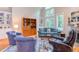 Bright living room showcasing a fireplace, large windows, and comfortable seating, creating a welcoming atmosphere at 313 Helmsdale Dr, Chapel Hill, NC 27517
