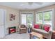 Bright living area with ample natural light from large windows and comfortable seating arrangements at 313 Helmsdale Dr, Chapel Hill, NC 27517