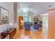 Open living room featuring hardwood floors, a fireplace, large windows, and vaulted ceilings, creating a bright gathering space at 313 Helmsdale Dr, Chapel Hill, NC 27517