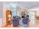 Bright living room with a vaulted ceiling, fireplace, large windows and comfortable seating creating a cozy atmosphere at 313 Helmsdale Dr, Chapel Hill, NC 27517