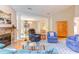 Comfortable living room with a fireplace and open view to the dining area, ideal for Gathering gatherings at 313 Helmsdale Dr, Chapel Hill, NC 27517