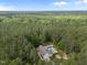 Lush homesite with a pool, fire pit, covered patio, and well-maintained lawn at 3653 Range Rd, Stem, NC 27581