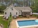 Aerial view of the backyard with pool, large deck and screened porch at 3653 Range Rd, Stem, NC 27581