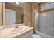 Bathroom with a shower-tub combo and beige countertop at 3653 Range Rd, Stem, NC 27581