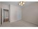 Neutral bedroom with carpet, ceiling fan, double door closet, and view to hallway at 3653 Range Rd, Stem, NC 27581