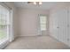 Bedroom with carpeted floors and a double-door closet at 3653 Range Rd, Stem, NC 27581