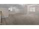 Spacious bonus room with vaulted ceilings, multiple windows, and neutral color scheme at 3653 Range Rd, Stem, NC 27581