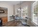 Breakfast area with natural light, wood floors, and neutral colors at 3653 Range Rd, Stem, NC 27581