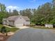 Charming home featuring a two-car garage, a fire pit, and a storage shed at 3653 Range Rd, Stem, NC 27581