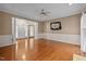 Spacious living room with hardwood floors offering an inviting entrance and access to other areas of the home at 3653 Range Rd, Stem, NC 27581