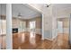 Spacious living room featuring hardwood floors, a cozy fireplace, and an open layout with natural light at 3653 Range Rd, Stem, NC 27581