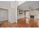 Inviting living room boasting hardwood floors, a classic fireplace, and an open, airy design at 3653 Range Rd, Stem, NC 27581