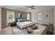 This is a virtually staged bedroom with great natural light and hardwood floors at 3653 Range Rd, Stem, NC 27581